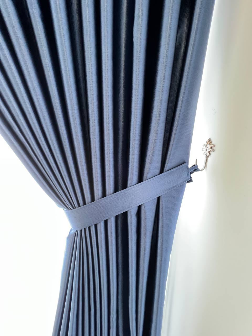 Custom S-Fold curtains in a bright living space