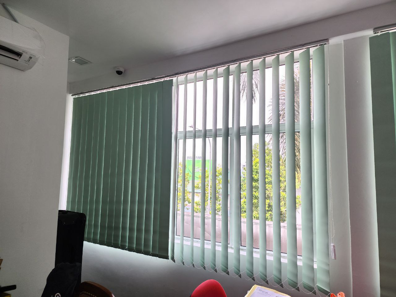 Vertical blinds providing privacy and light control in an office